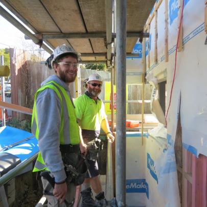 Carpenters Mason Grubb (left) and Jason Oats work on Mercy Hospital’s new Day Stay facility.