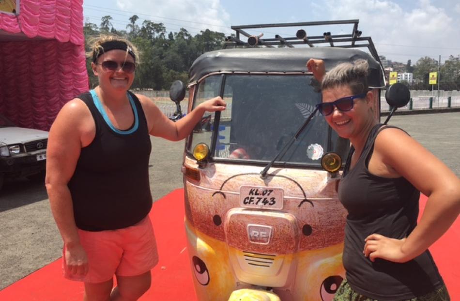 Jendi Paterson (left) and Stacy McTaggart celebrate making it to the finish line of the Rickshaw...