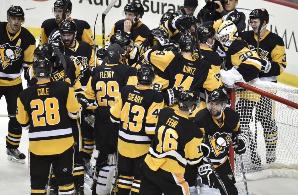 Pittsburgh Penguins players celebrate after advancing to the Stanley Cup Finals. Photo: Reuters