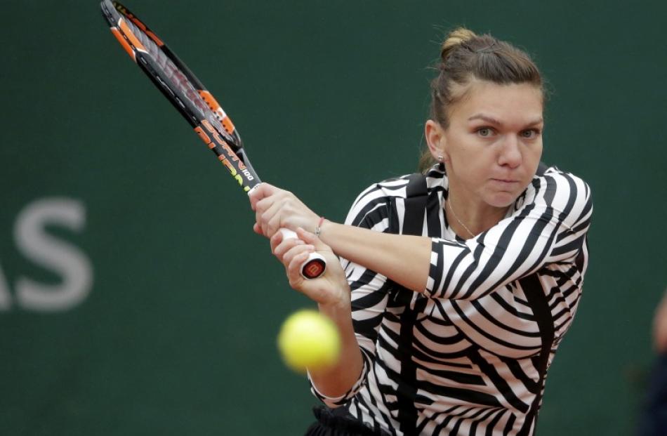 Simona Halep in action against Samantha Stosur. Photo: Reuters