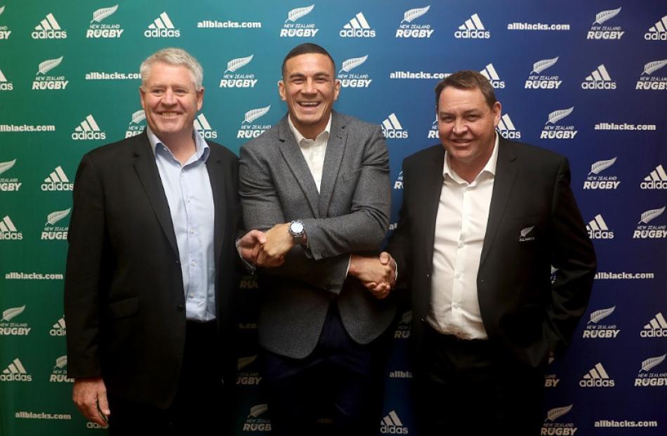Sonny Bill Williams shakes hands with Steve Tew and Steve Hansen after signing with NZR and the...