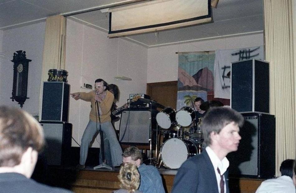 Dunedin punk band the Enemy performing at the Beneficiaries Hall in 1978, with Roger Shepherd at...