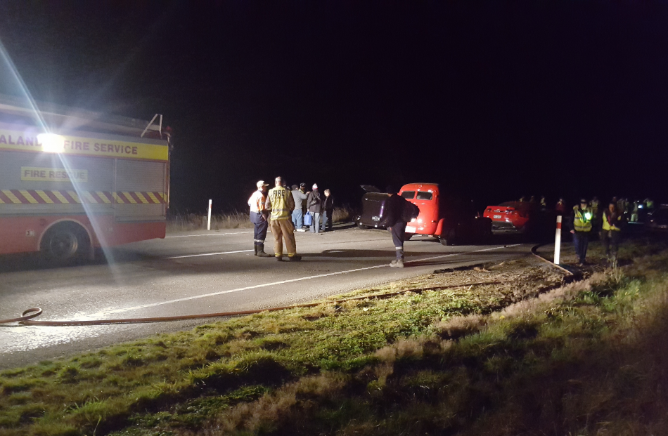 Emergency services at the scene of the crash, near Karitane. Photo by David Loughrey