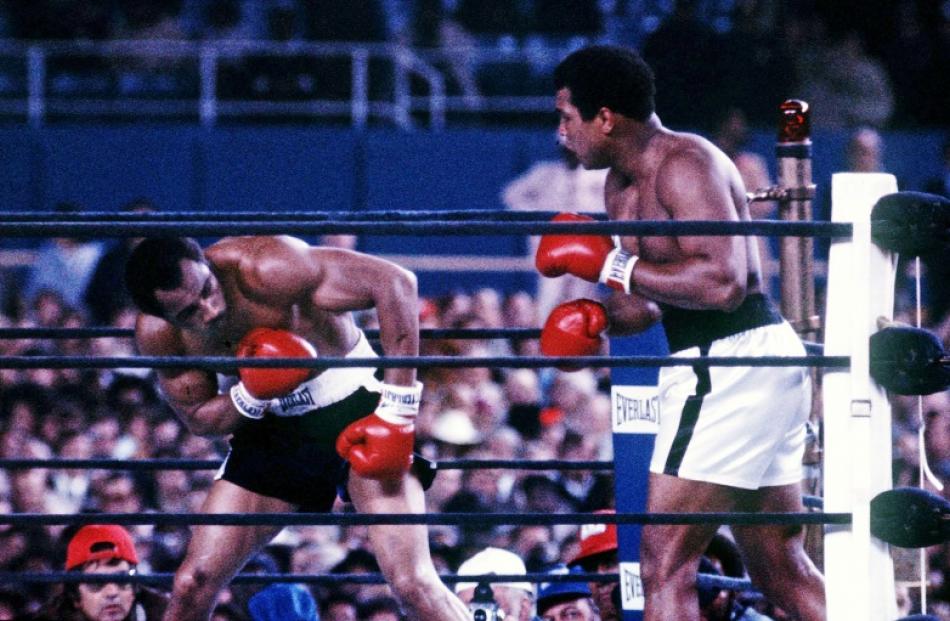 Muhammad Ali (R) fights Ken Norton at Yankee Stadium in the third fight between the two...
