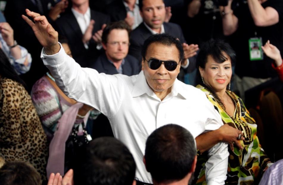 Muhammad Ali standing with his wife Yolanda as he is introduced at the MGM Grand Garden Arena in...