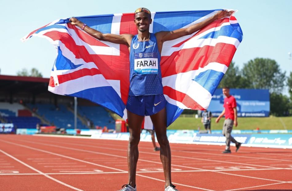 Mo Farah celebrates winning the men's 3000m. Photo: Reuters