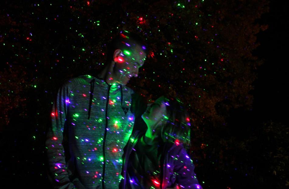 Marja Captijn and her daughter stand outside their house decorated with fairy lights in Tapanui....