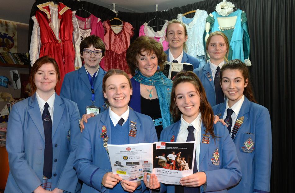 Queen's High School Head of Drama Terry MacTavish (centre) with Year 13 pupils who won awards at...
