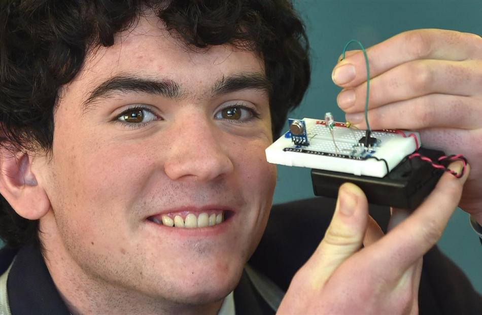 William Satterthwaite with a prototype circuit board which he hopes will control one of many...