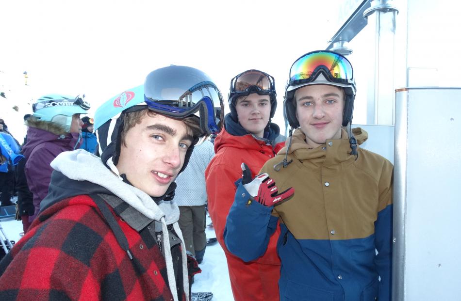 Oliver Hill (left) Ben Evans and Simon Morganty slept on Coronet Peak overnight to be first on...