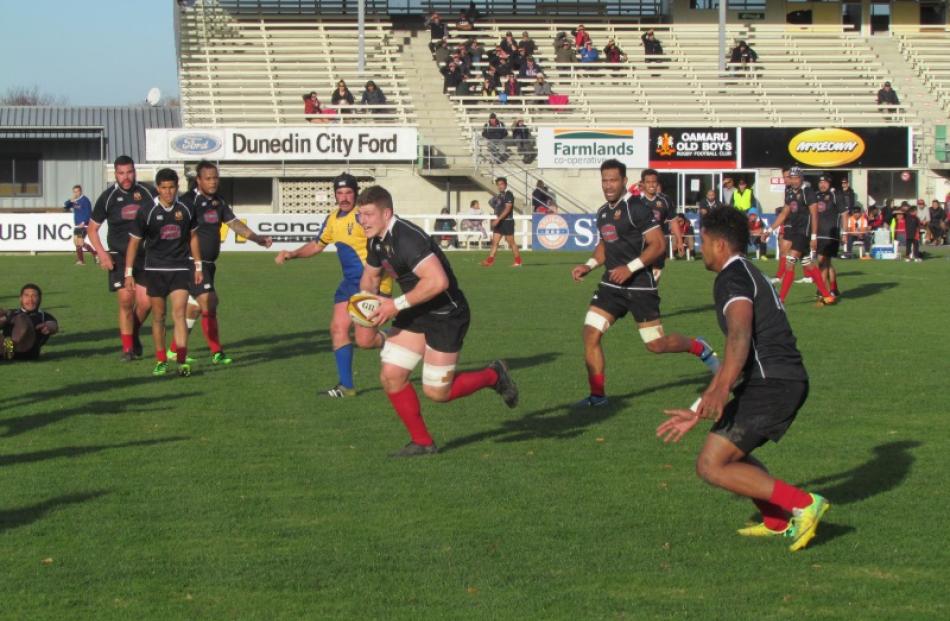 Old Boys on the attack against Valley at Whitestone Contracting Stadium in Oamaru today. PHOTO:...