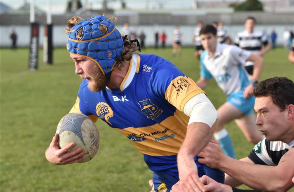 Taieri No8 and captain Willis Scott charges for the line while his opposite Kylie Harris attempts...