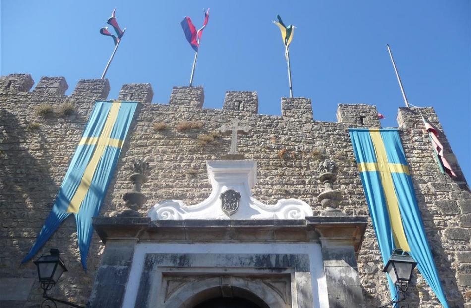 A castle wall greets visitors to Obidos, in Portugal.