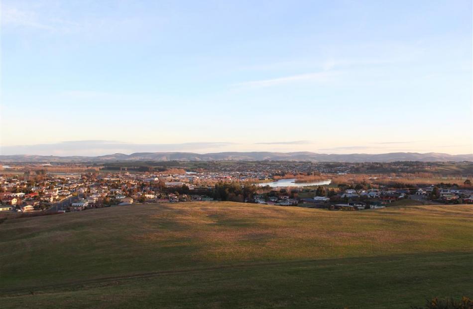 Looking southwest from the north Balclutha subdivision over the Clutha River to the town’s...