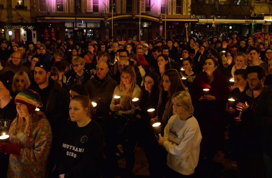 People gather in the Octagon last night for the candlelight vigil. Photo: Linda Robertson