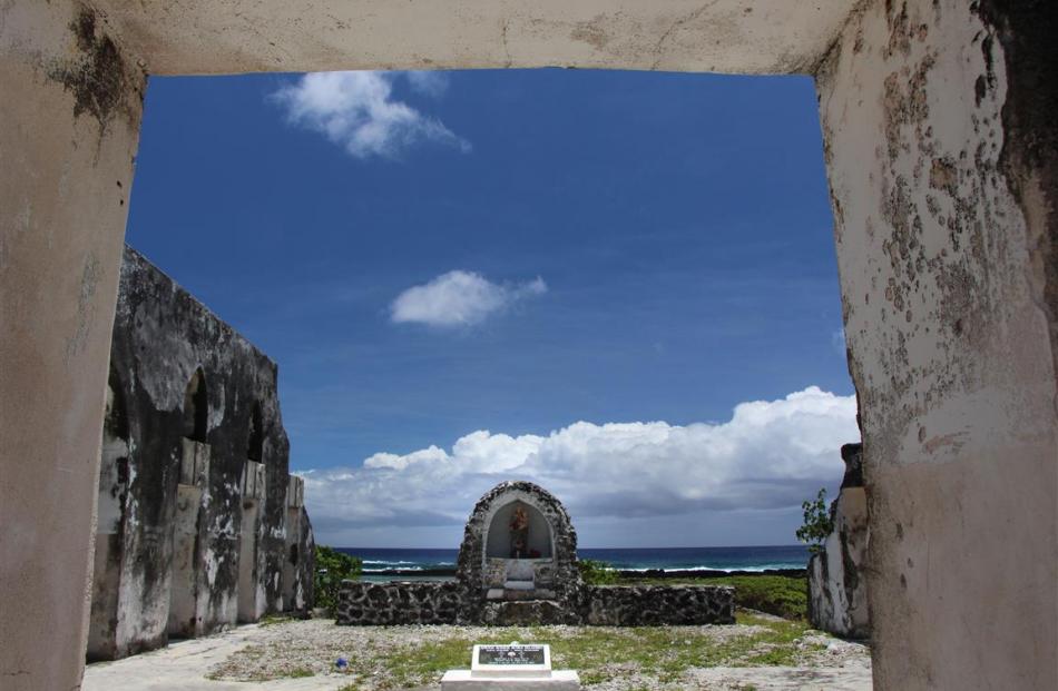 Surf and sky are the backdrop to this shrine seen through the gaping entrance to the cyclone...