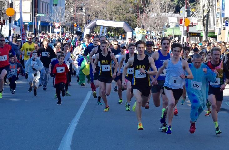 Runners vie for position just after the start of the Golden Mile race.