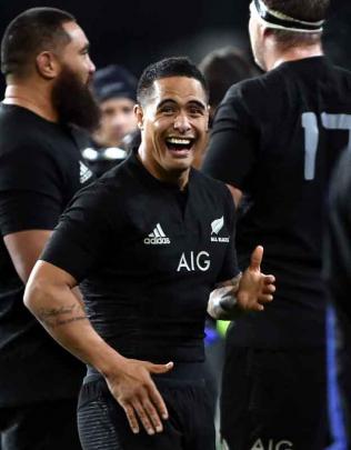 Fullback Israel Dagg celebrates scoring a try as winger Ben Smith approaches to offer...