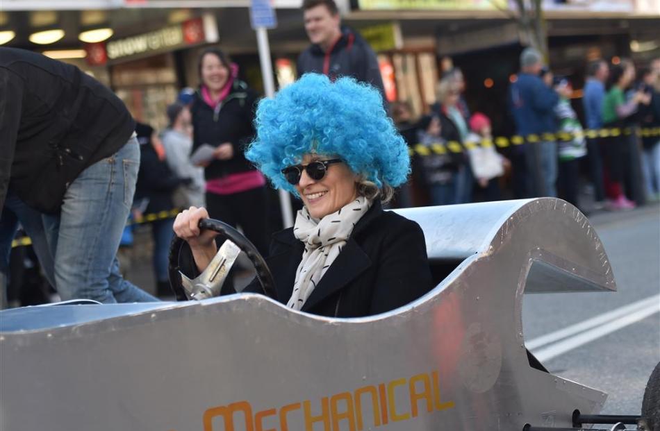 Emma Smitz, of Queenstown, drives a tool-shaped trolley cart in the Queenstown Winter Festival...