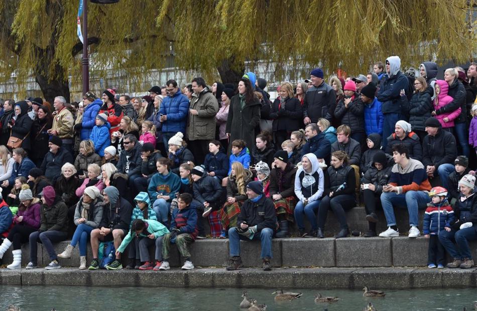 The ducks take shelter in front of the crowd watching the Birdman competition.