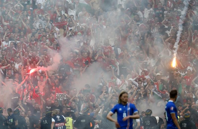 Hungary fans are seen with flares during their team's game against Iceland. Photo: Reuters