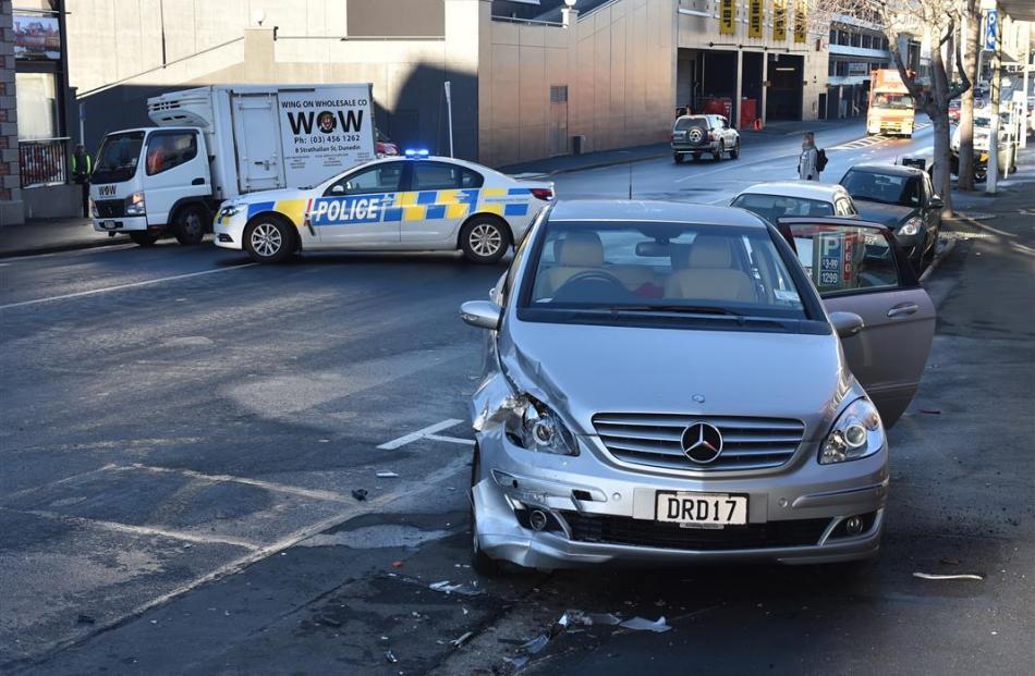 Police were busy attending crashes yesterday, one after a truck (not pictured) hit  a parked car...