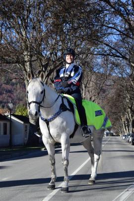 Sergeant Kate Pirovano, of Queenstown, on her horse, Slide, yesterday afternoon in Arrowtown...