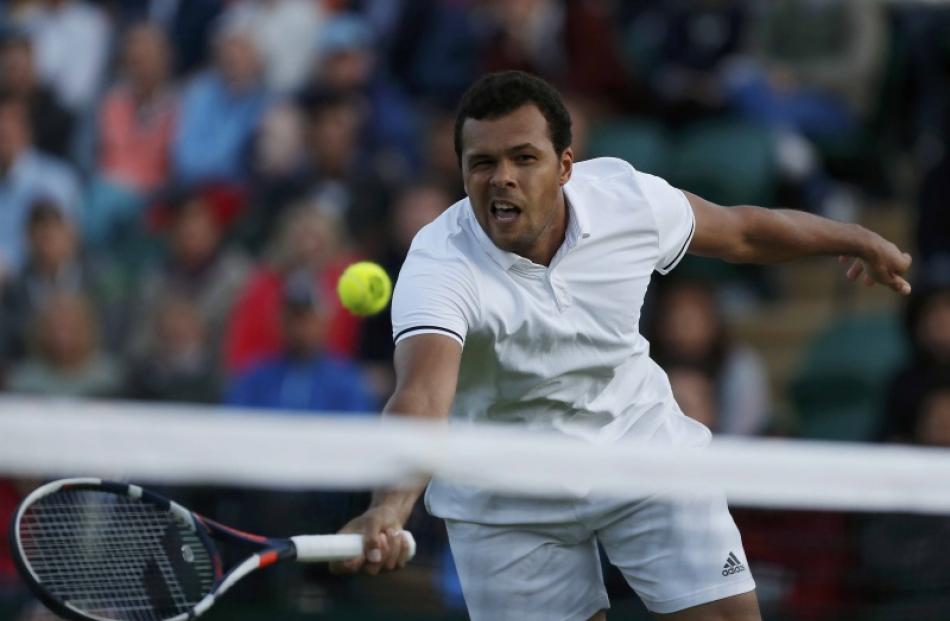 Jo-Wilfried Tsonga in action against John Isner. Photo: Reuters