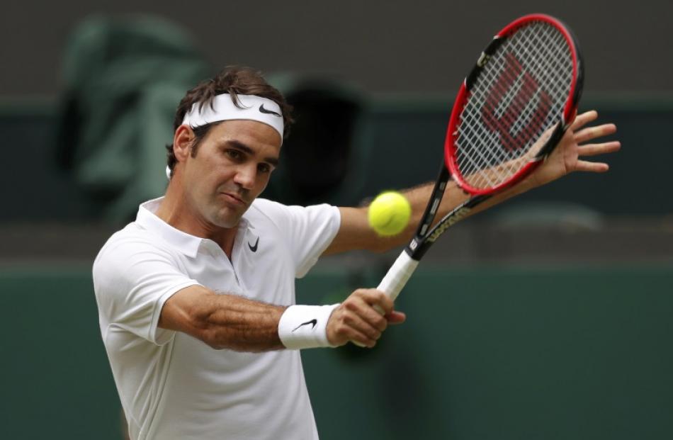 Roger Federer plays a shot during his win. Photo: Reuters