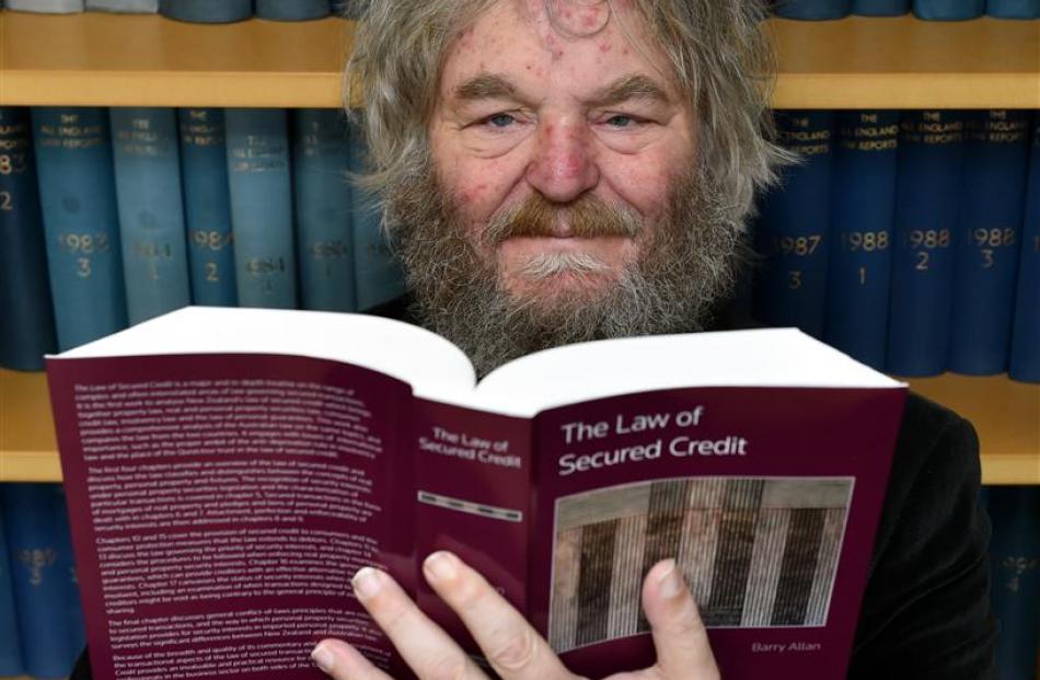 University of Otago senior law lecturer Barry Allan with his 2000-page text on credit law. Photo...