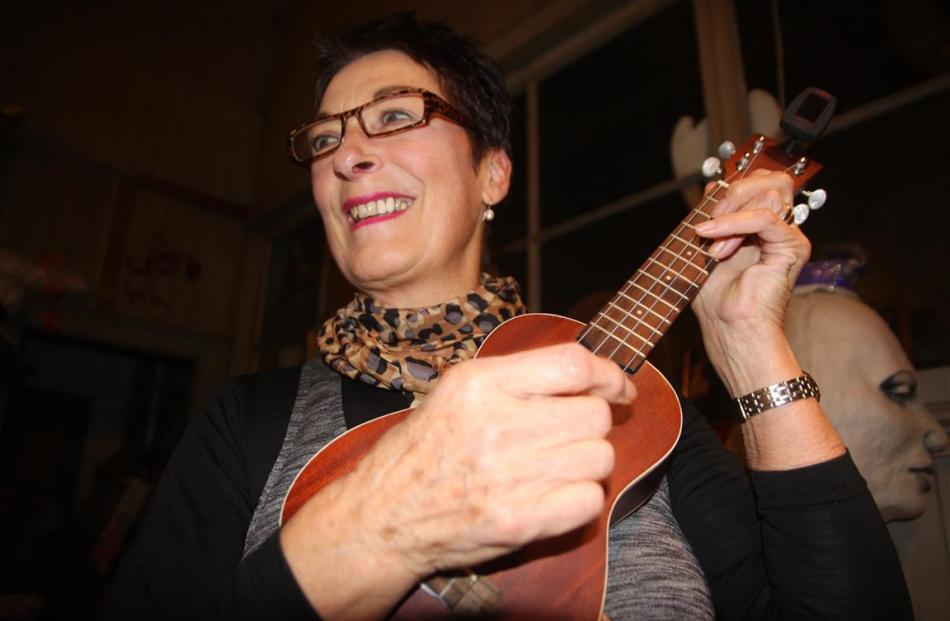 Ukulele Ensemble band member Ann Willetts strums  a musical classic. Photo: Shannon Gillies