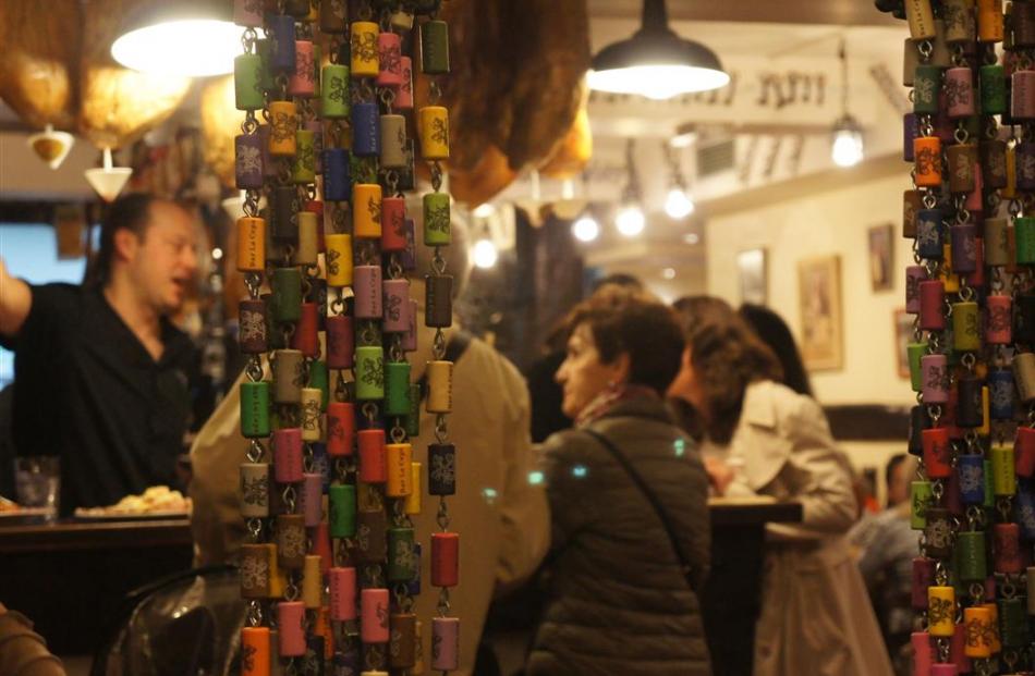 Enjoying Pintxos tapas with the locals in San Sebastian, Basque Country, Spain.