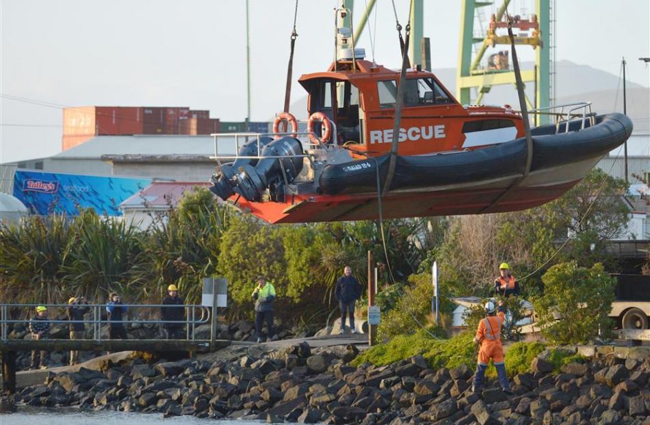 Former Coastguard Marlborough rescue boat Interisland Rescue is  lowered into Careys Bay...