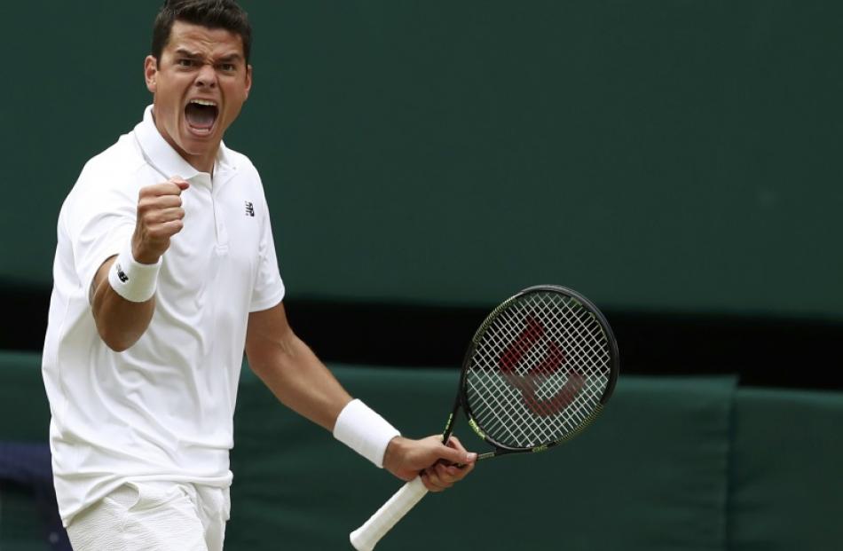 Canadian Milos Raonic celebrates beating Roger Federer. Photo: Reuters