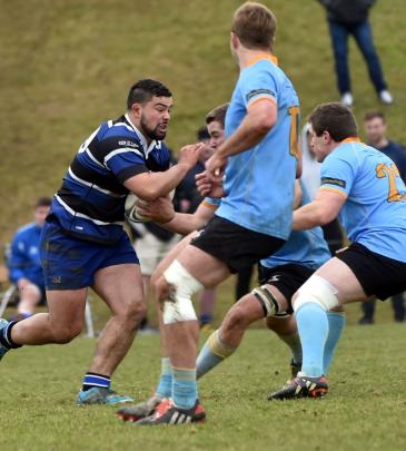 Action from today's Kaikorai v University match. Photo: Peter McIntosh