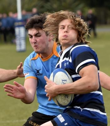 Action from today's Kaikorai v University match. Photo: Peter McIntosh