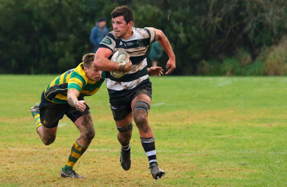 Action from today's match between Southern and Green Island. Photo: Caswell Images