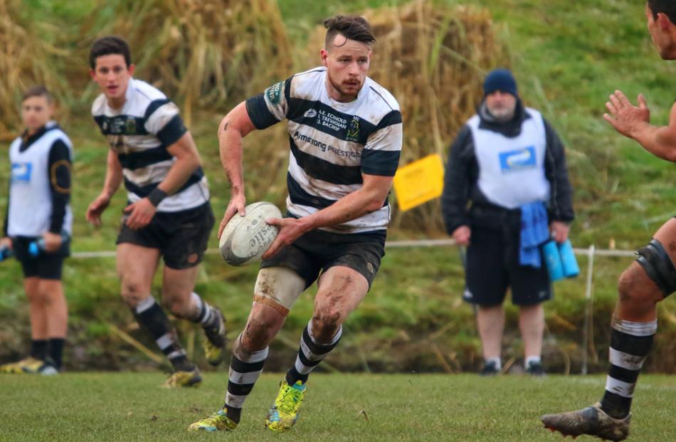 Action from today's match between Southern and Green Island. Photo: Caswell Images