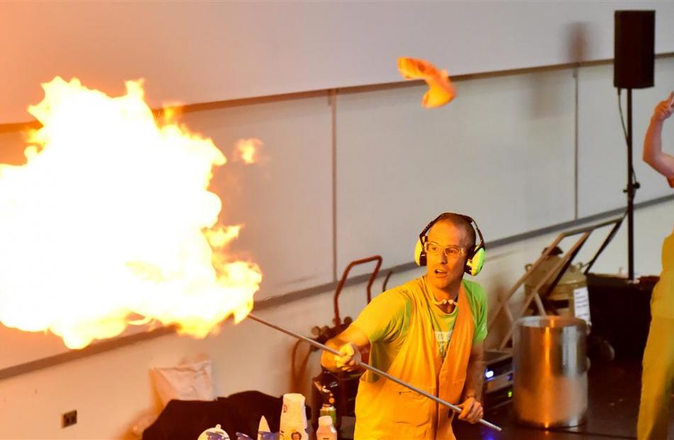 Dr Graham Walker (left), assisted by DJ Sixfootsix (Chris Foster), lights a balloon filled with...