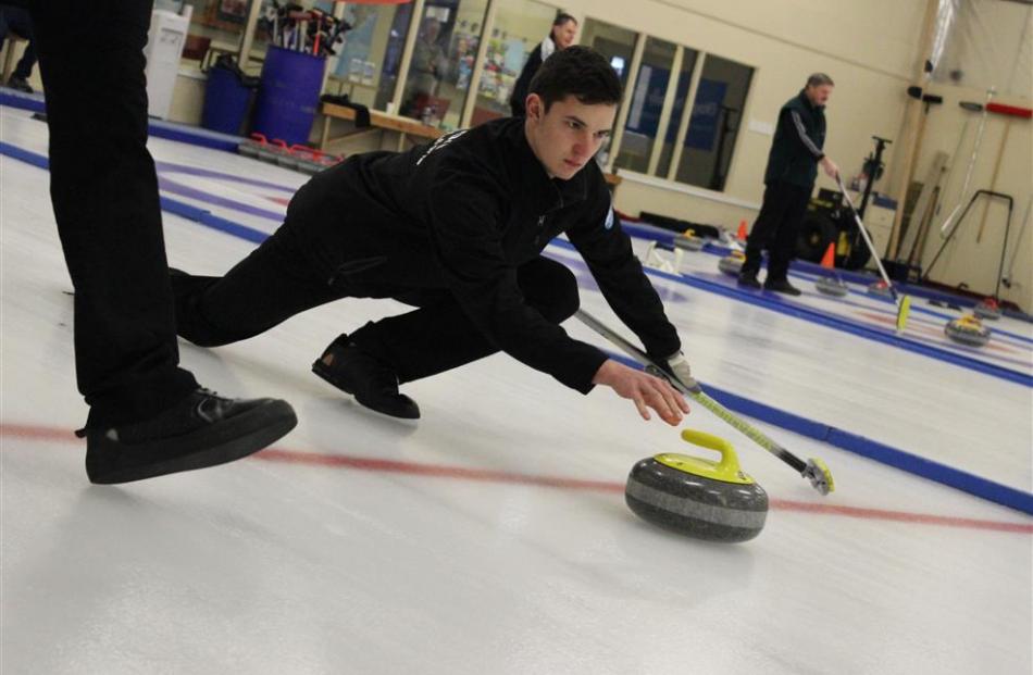 Matthew Neilson, of Ranfurly, slides a stone with pinpoint precision at the New Zealand Curling...