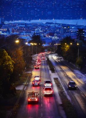 Motorists travel slowly down Stuart St, Dunedin, yesterday. PHOTOS: GERARD O'BRIEN