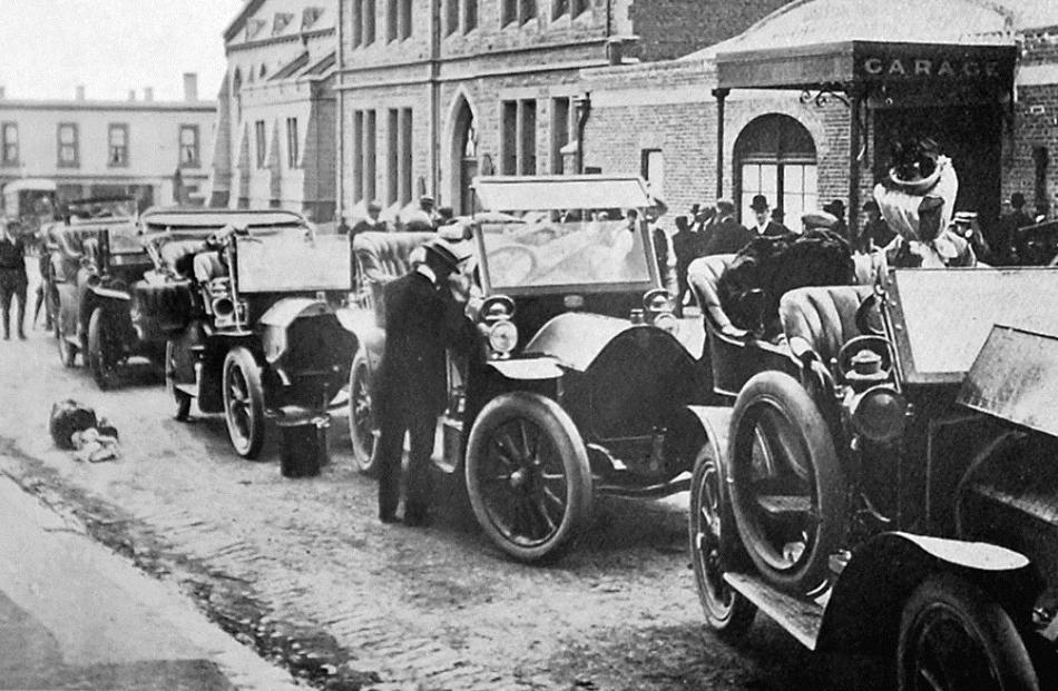 Cars competing in a Dunedin to Christchurch reliability run prepare to leave from outside Cooke...