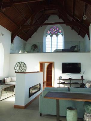 Today the original stained glass windows have been retained and let light into the open plan...