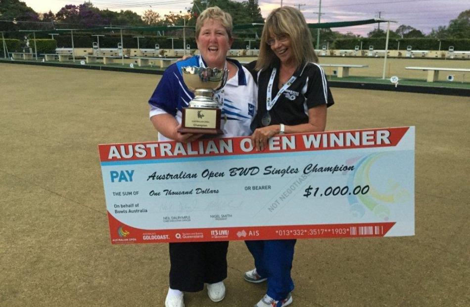 Dunedin’s Carolyn Crawford (left) holds the winner’s cheque with runner-up Pam Walker, of Lauder,...