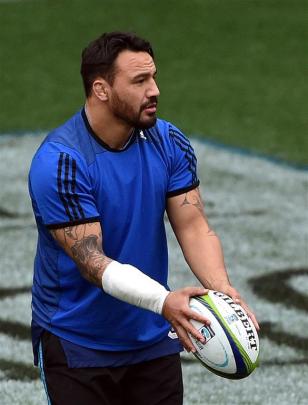 Highlanders hooker Ash Dixon looks to drop kick a ball at training at Forsyth Barr Stadium...