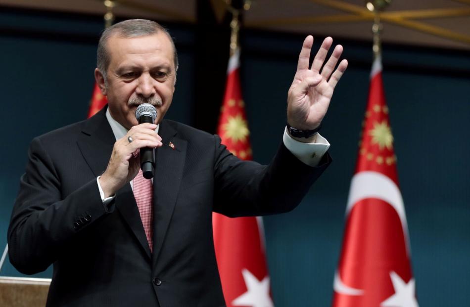 Turkish President Erdogan addresses the nation in a live television broadcast from the...