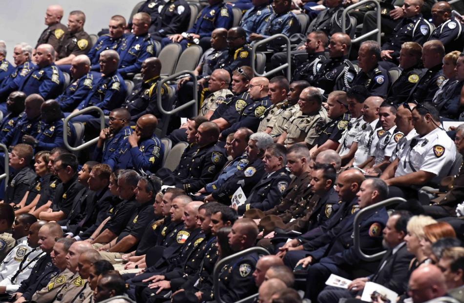 Police officers from departments around the country attend funeral services for Baton Rouge...