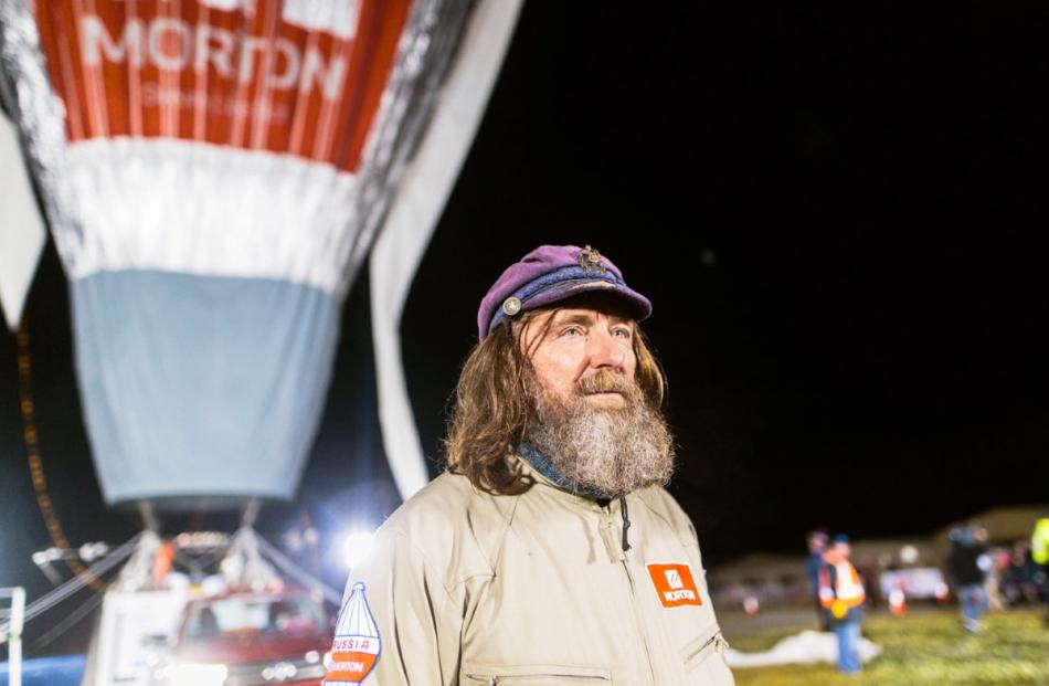 Russian adventurer Fedor Konyukhov is seen in front of his balloon as it is inflated before the...