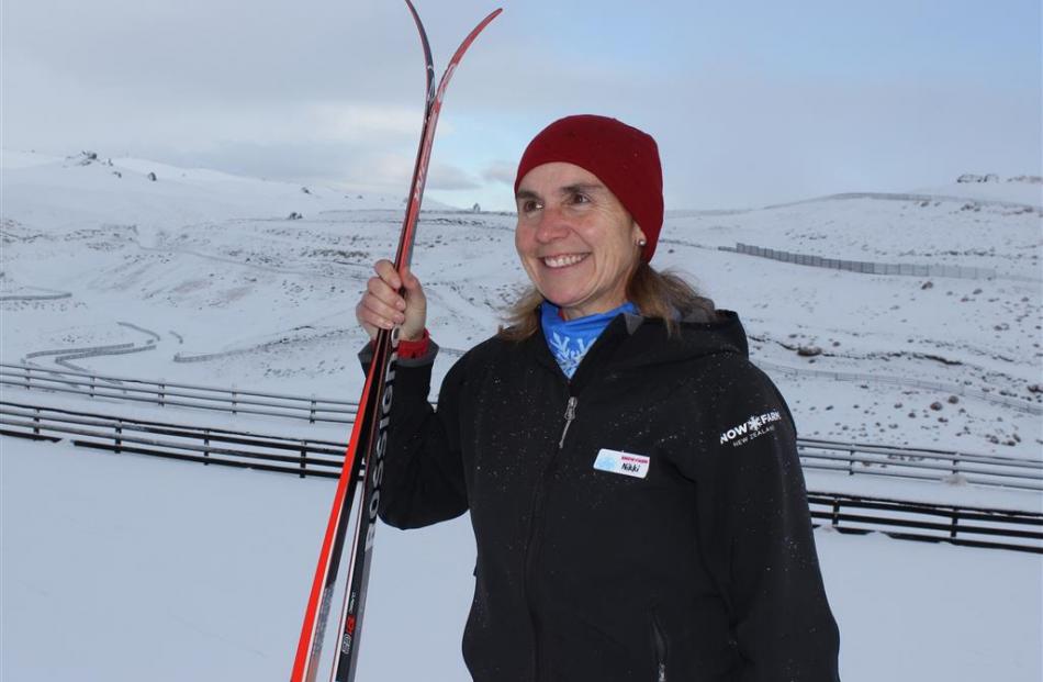 The clouds part as Snow Farm general manager Nikki Holmes checks  cross-country ski trails on the...