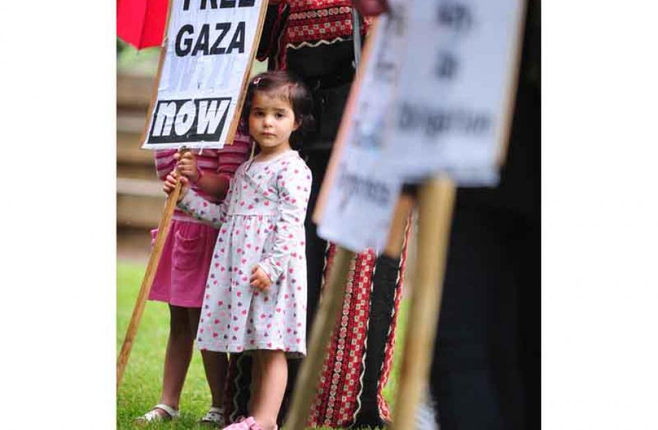 Jasmin Sharab (2)of Dunedin holds a placard.